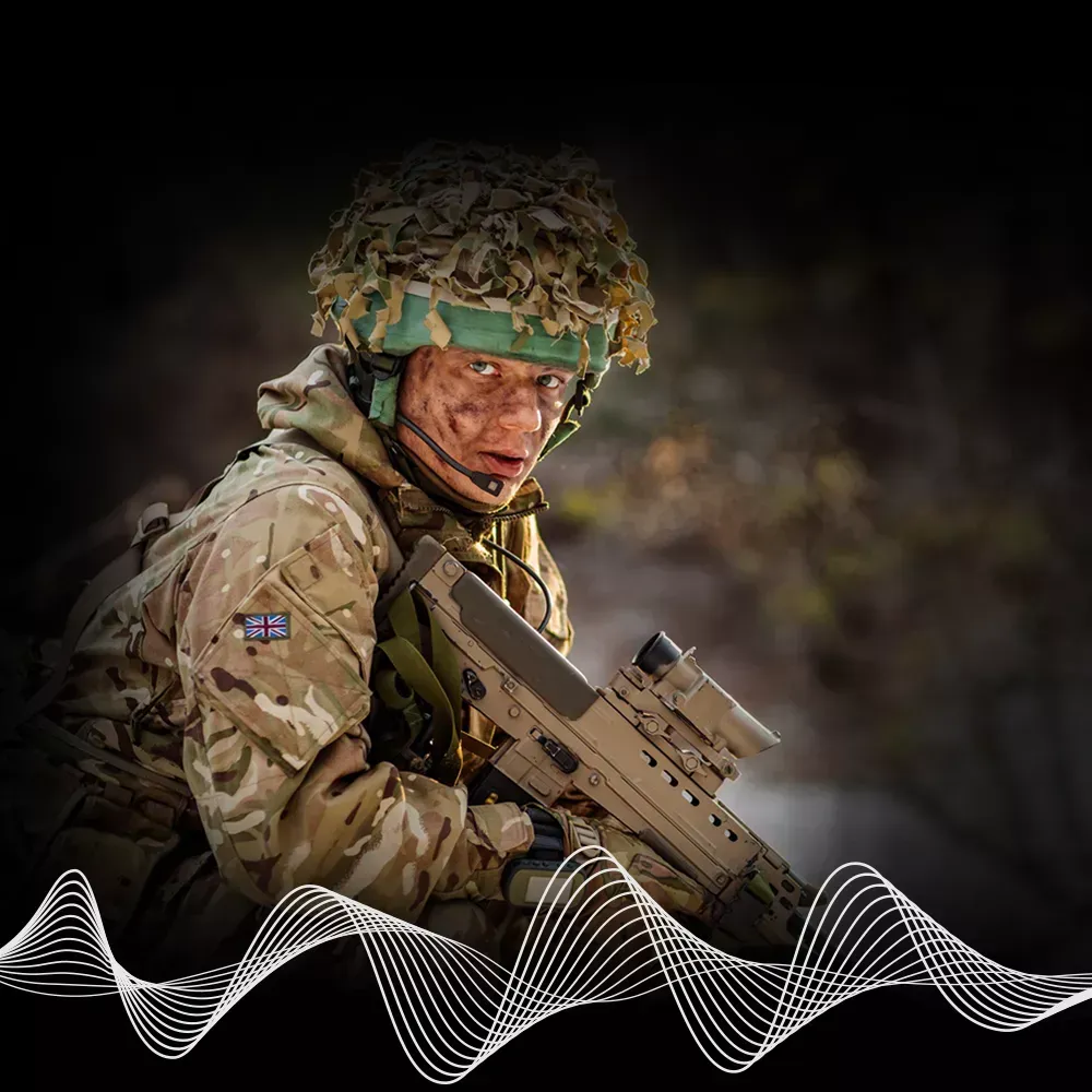 British Soldier looking at the camera with RF radio wave against a dark background
